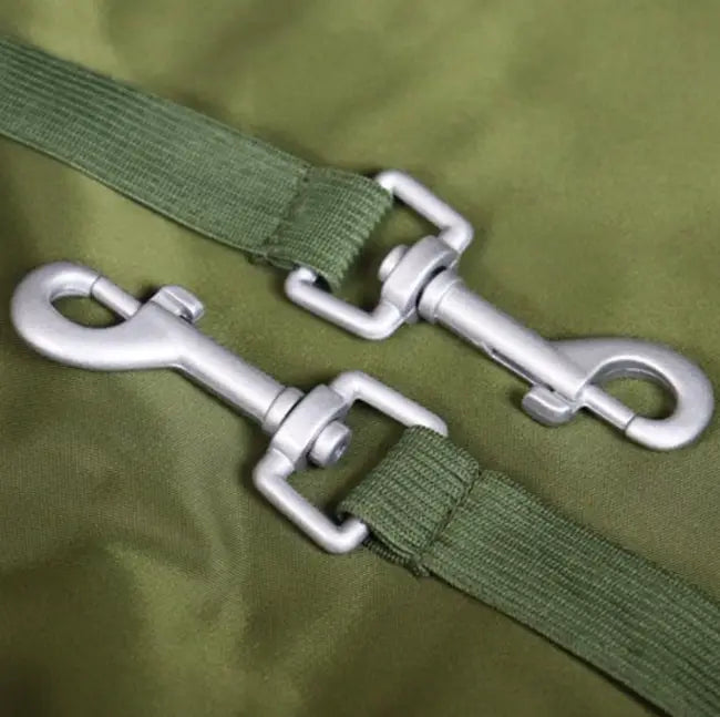 Two green straps with metal clamps for the Urban Pet Car Box.